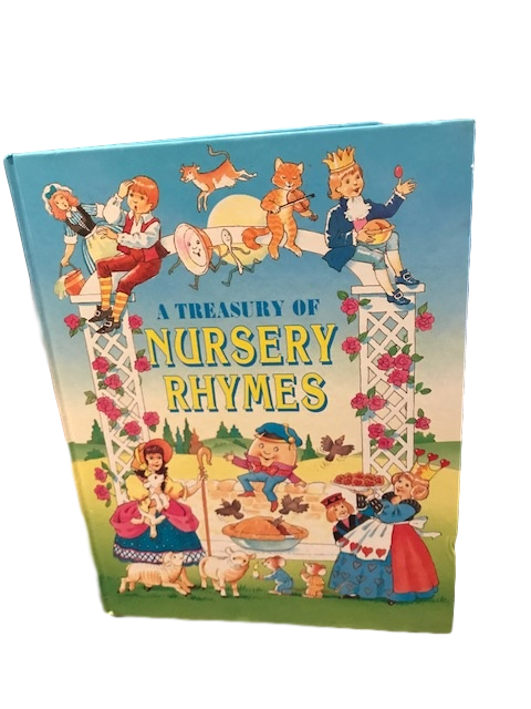 A vintage book of Nursery Rhymes. The text says, "A TREASURY OF NURSEY RHYMES". The cover features characters from various fairytales and nursery rhymes include the Queen of Hearts, Little Bo Peep, and Humpty Dumpty. Several characters are sitting on a white arch covered in red roses.