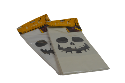 A pair of two packages containing Halloween themed black and white bags. The white bags inside the orange packaging feature a skeleton face/skull that is grinning. The text on the bags states "8 LUMINARY BAGS".